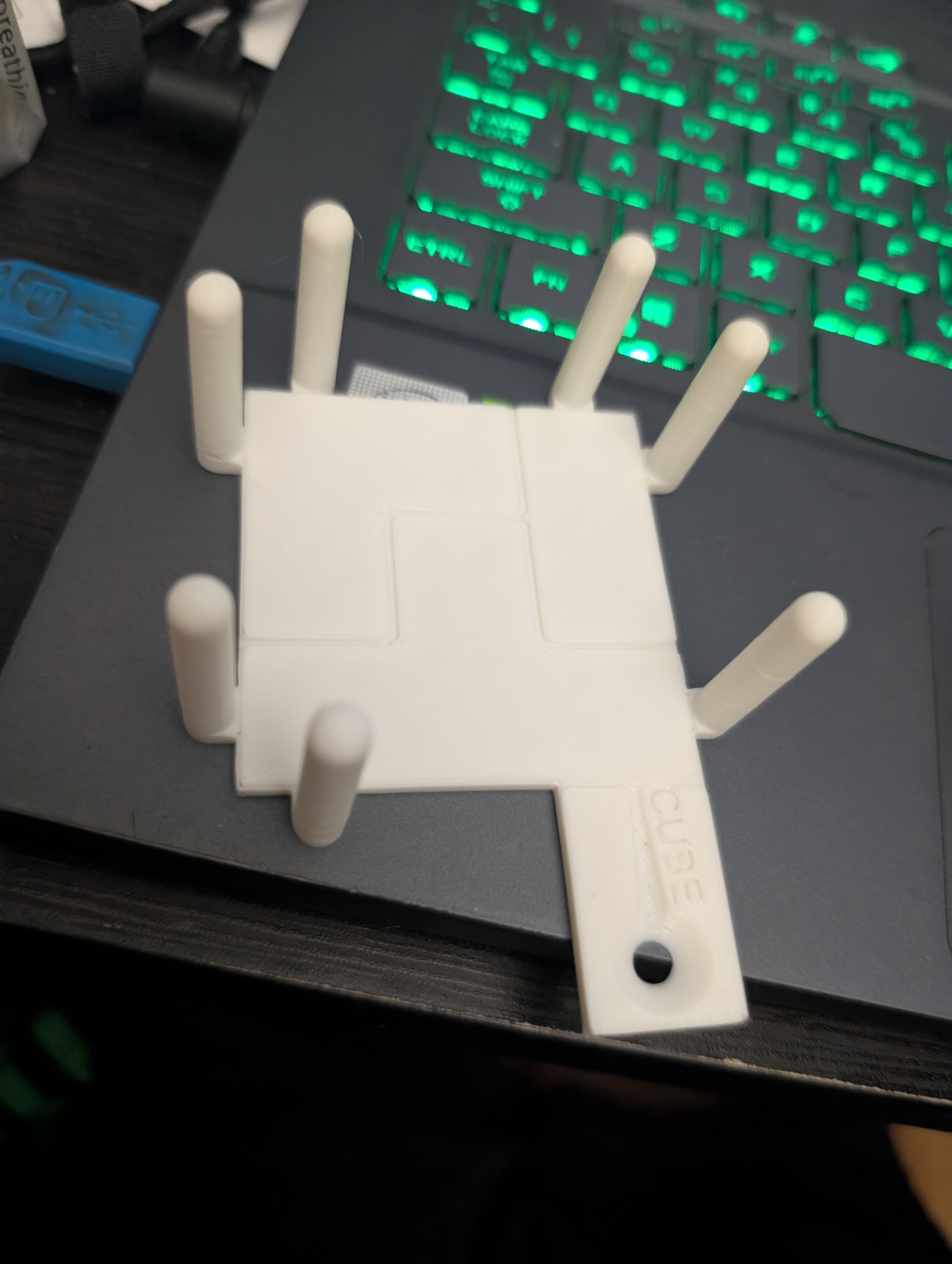 A base for the cube with indents showing the bottom configuration